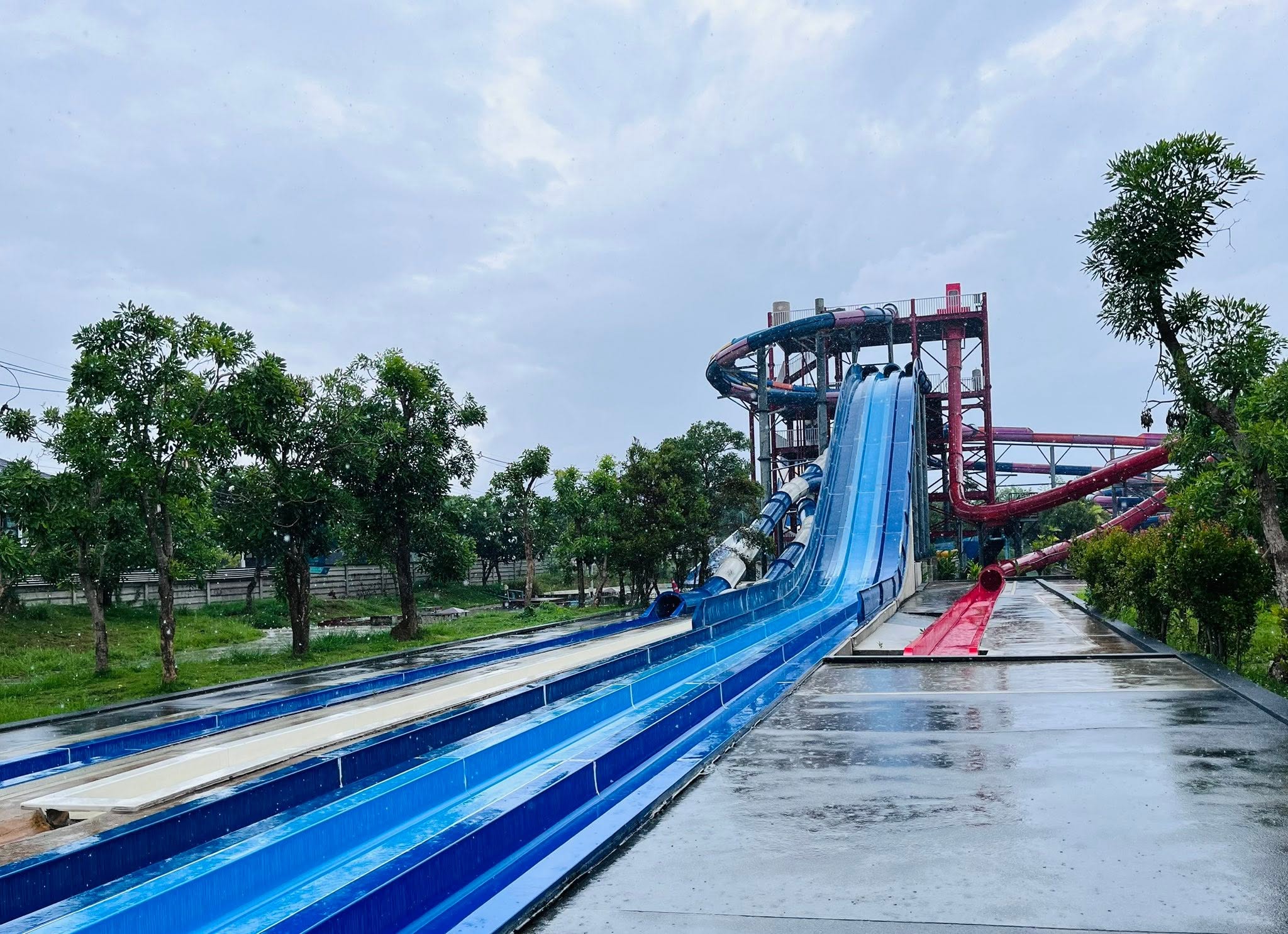 Rider using a high-speed racing slide at Tube Trek Water Park