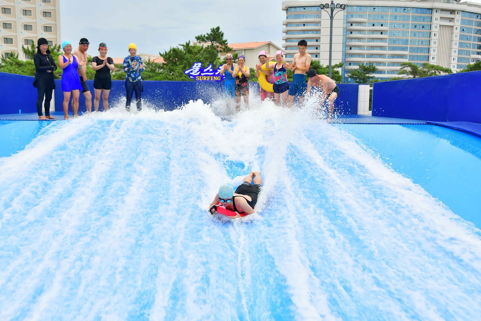 Visitor using the Surf Simulator at Myongsasimni Water Park in Wonsan