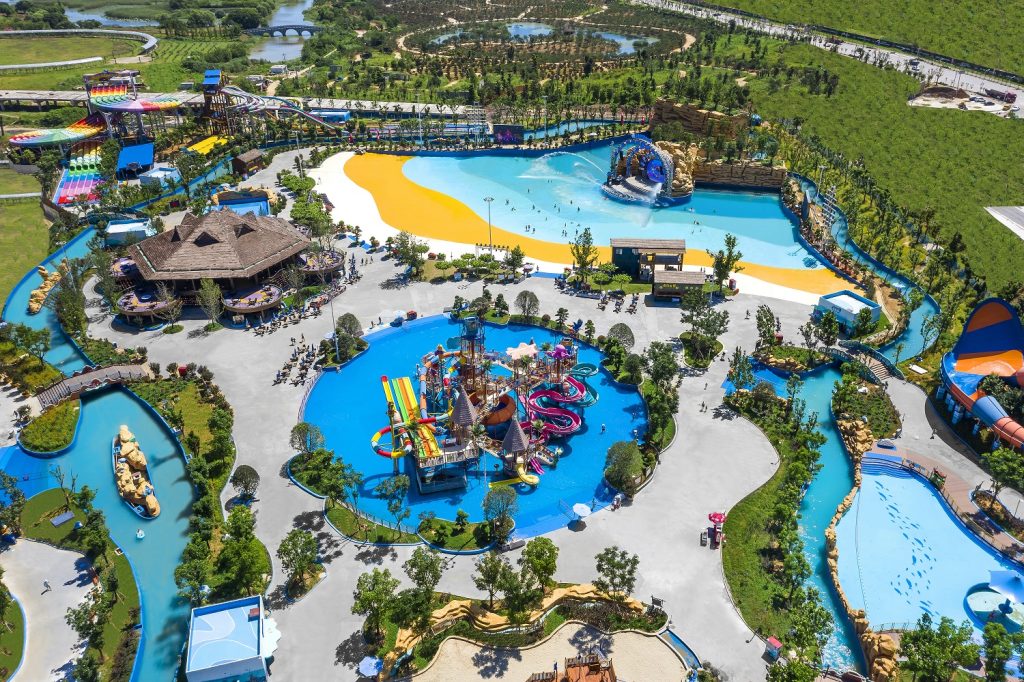 Aerial view of Taihu Dragon Dream Water Park with a wave pool, slides, and family water-play areas