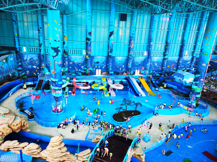 Indoor family water-play area with children's slides at Taihu Dragon Dream Water Park